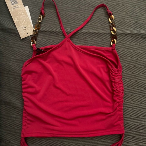Fuchsia top blouse new, size small with horn details
