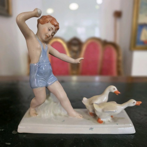 Royal Dux porcelain figurine child with geese used