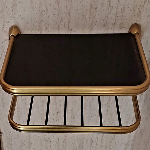 Vintage hanging wall shelf used with black glass and brass
