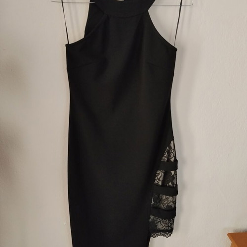 Black mini dress like new with open back and lace slit