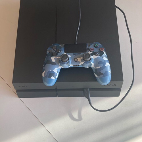 PlayStation 4 Fat 500GB console used with DualShock 4 controller