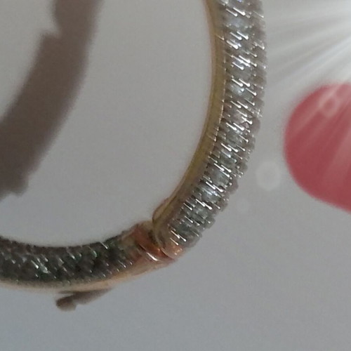 Gold hoop earrings with zircon stones