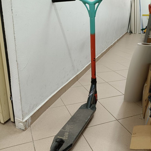BMX stunt scooter used with scratched bottom