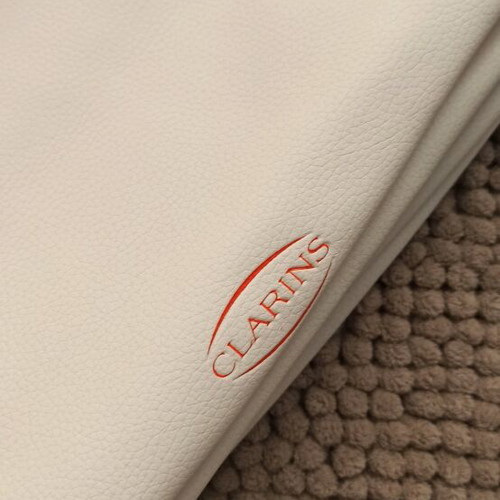 Clarins cosmetic bag new, white with striped handles