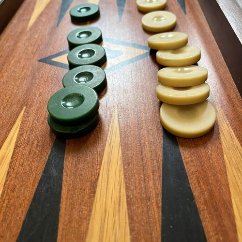 Handmade wooden backgammon used with dice and checkers