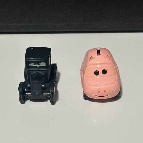 Disney Cars diecast metal toy cars set of 2 like new (black & pink)