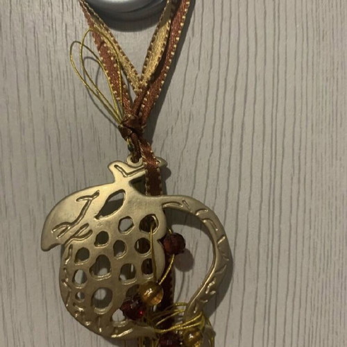 Hanging pomegranate charm new with gold and red ribbon
