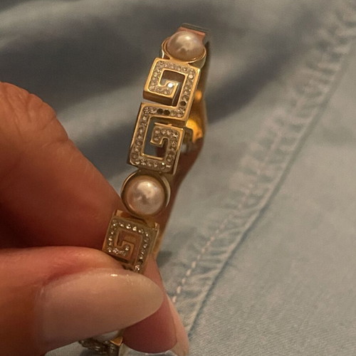 Steel bracelet used, gold color with meander design, crystals and pearls