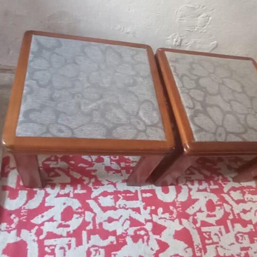 Wooden side tables with plastic protection and decorative fabric
