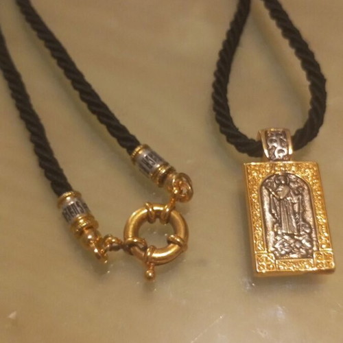 Religious pendant necklace like new, gold and silver
