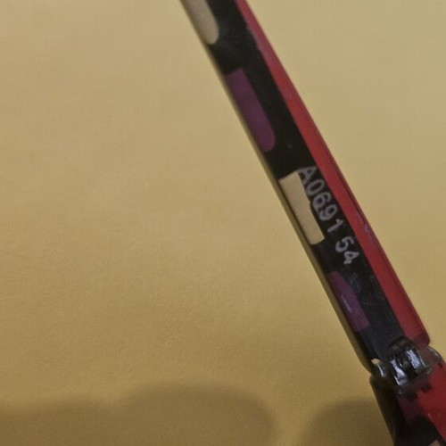 Alain Mikli eyeglass frame used, black and red