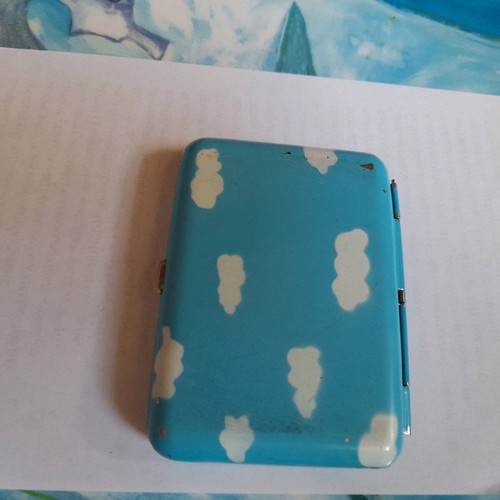Tobacco case used, sky blue with white smoke clouds