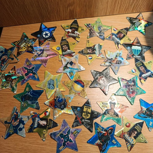 Set of 31 used metal star-shaped tags