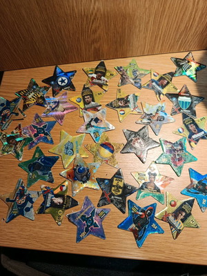 Set of 31 used metal star-shaped tags