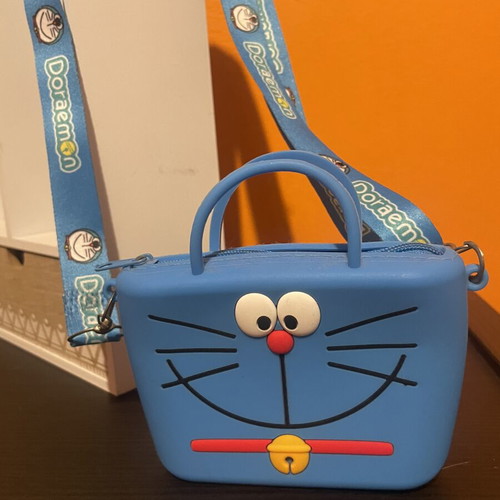 Doraemon crossbody bag like new, blue turquoise silicone