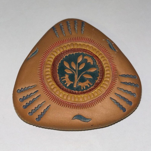 Vintage decorative clay paperweight with ethnic embossed designs, like new