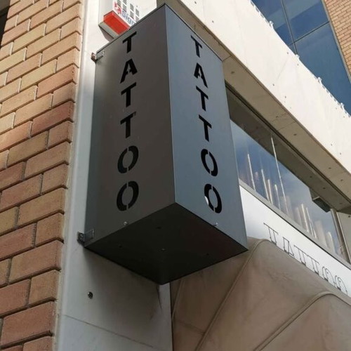 Metal tattoo studio sign like new