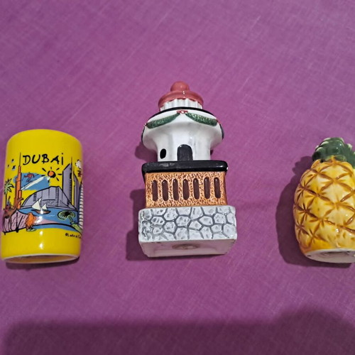 Salt and pepper shakers used, designs lighthouse, pineapple, Dubai