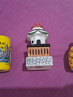 Salt and pepper shakers used, designs lighthouse, pineapple, Dubai