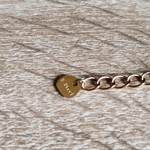 Necklace new steel gray and gold color