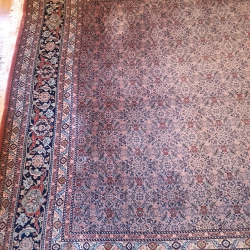 Handmade wool rug used, approximately 10 sqm
