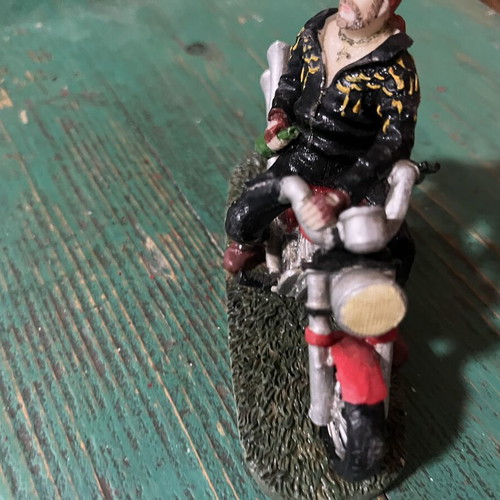 Vintage collectible biker figure on red motorcycle, like new