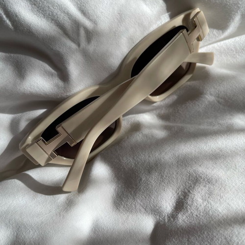 Sunglasses new, beige with metal decoration
