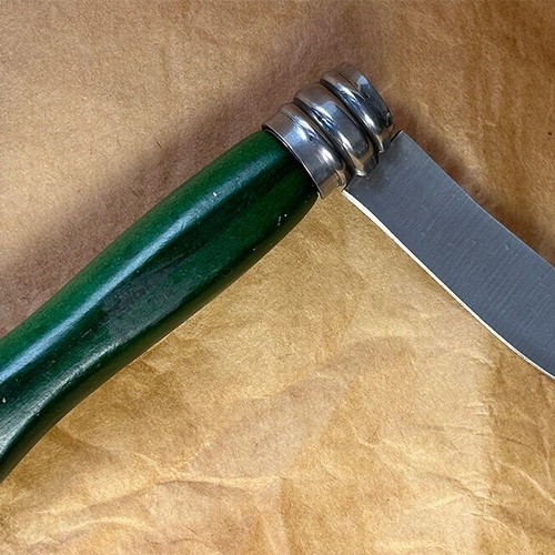 Green 7cm folding knife used with slight marks