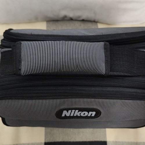 Nikon camera bag like new with shoulder strap and multiple compartments