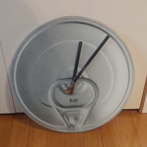 Glass wall clock like new with soda can lid design