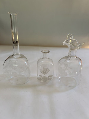 Miniature glass bottles with floral engravings