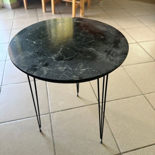 Round side table used with black marble look and metal hairpin legs