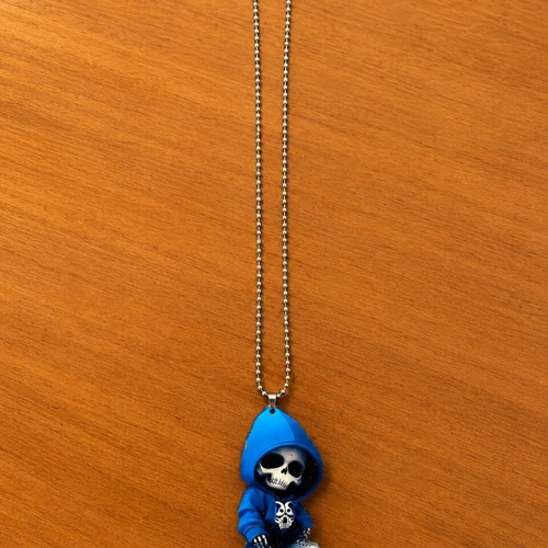 Necklace with metal chain and blue hooded skull pendant