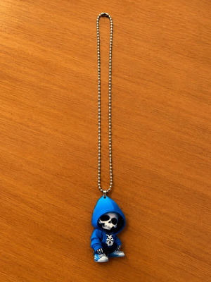 Necklace with metal chain and blue hooded skull pendant
