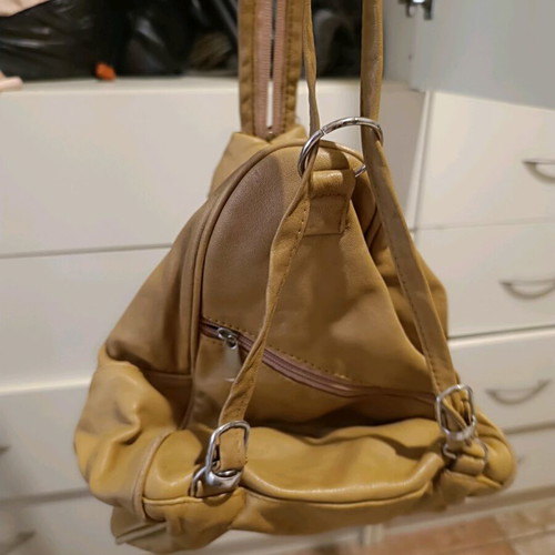 Leather backpack beige like new with multiple pockets and zippers