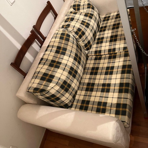 Two-seater sofa bed new with embossed beige cover