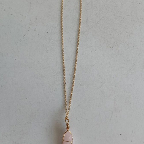 Jewelry set with rose quartz and gold-tone metal elements