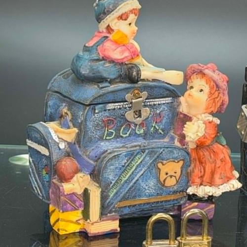 Vintage polyresin piggy banks with three locks and working key