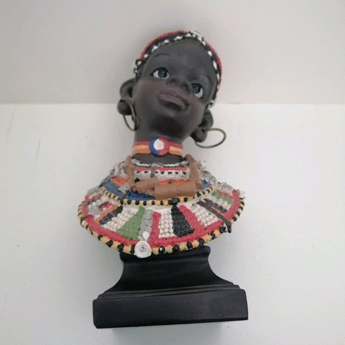 African figurine like new with intricate bead jewelry
