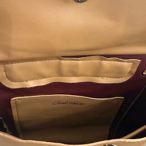 Axel beige backpack like new with missing decorative cord