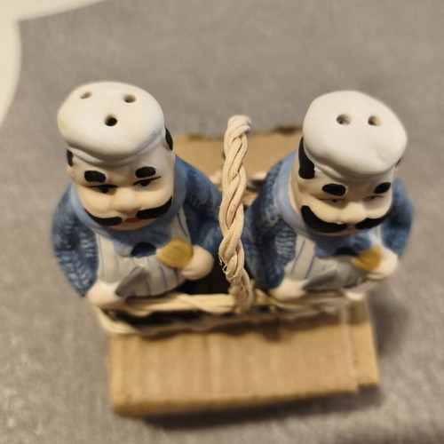 Vintage salt and pepper set with chef figures in wicker basket