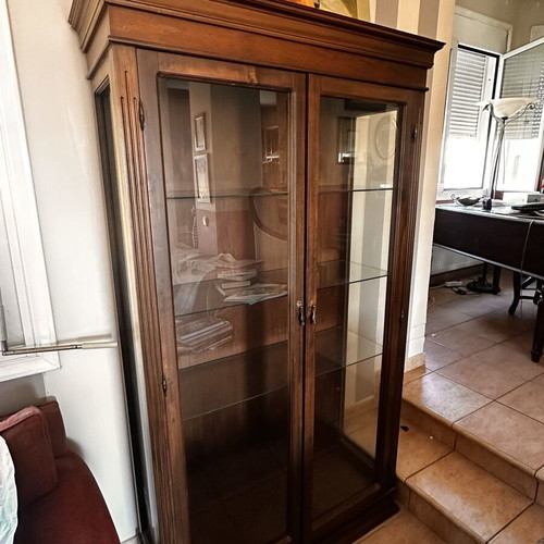 Wooden display cabinet with glass doors and shelves