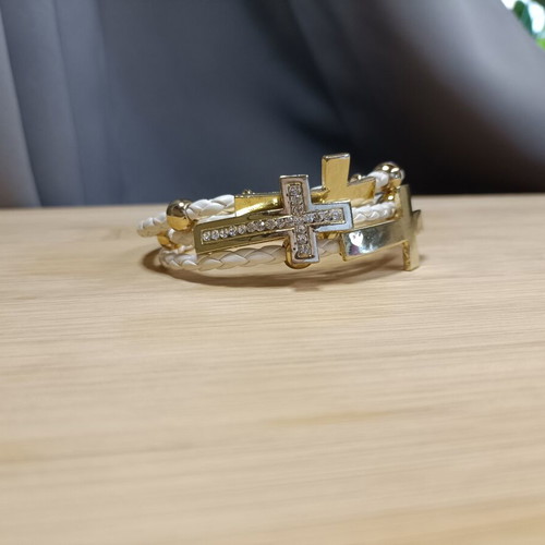 White and gold women's bracelet with rhinestones