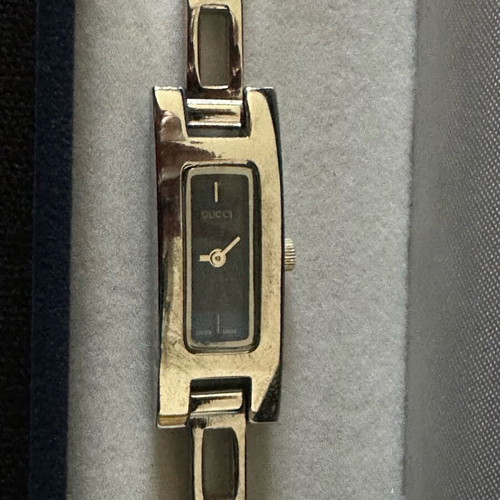 Gucci women's watch like new with silver metal bracelet