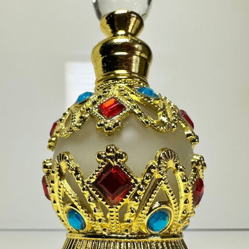 Vintage Arabic perfume bottle with gold metal frame and stones