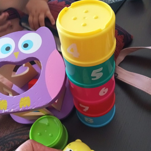 Toy set used with stacking cups and wooden owl shape sorter