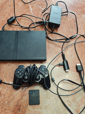 PlayStation 2 Slim used with controller and memory card