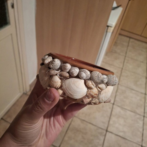 Handmade flowerpot like new made of seashells