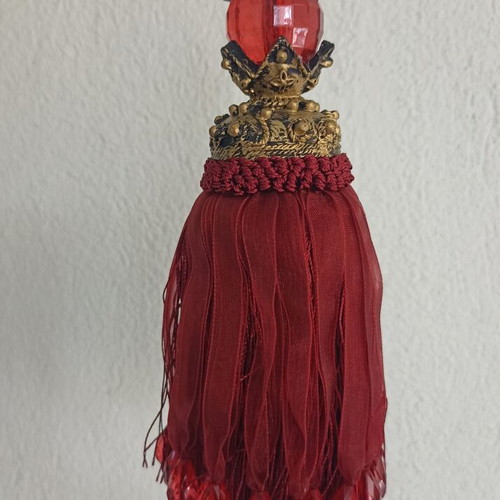 Red fabric decorative tassel used with hanging ornament gift