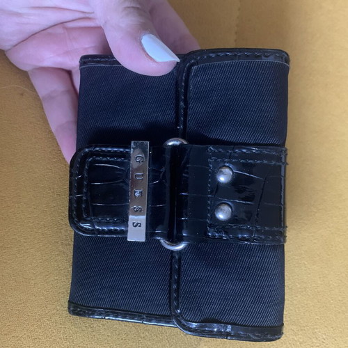 Guess wallet used, black canvas with faux croc details